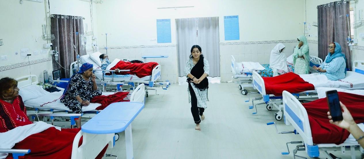 Girl from Bihar performs a dance of sacred solace in Delhi Hospital